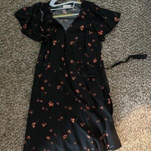 Black dress with orange flowers perfect for spring